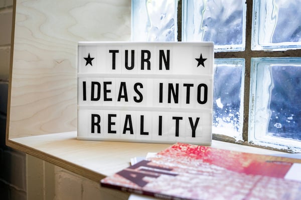 Turn Ideas Into Reality sign — open minded and innovative